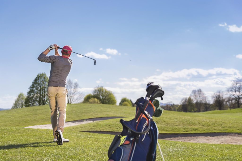 Young man playing golf Hudson Valley NY golf course