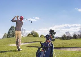 Young man playing golf Hudson Valley NY golf course